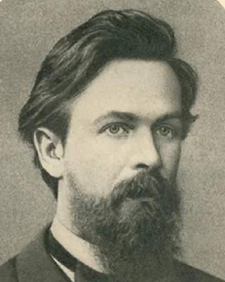 Andrei Markow 1886, eine alte Fotografie: ein junger Mann mit Vollbart und zurückgekämmtem Haar, in dunklem Anzug, leicht zur Seite blickend.