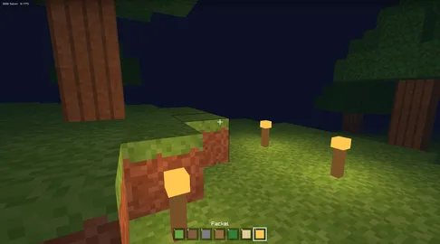 Eine Blockwelt mit Bäumen auf grüner Wiese, unten eine Leiste mit Blöcken zum Bauen