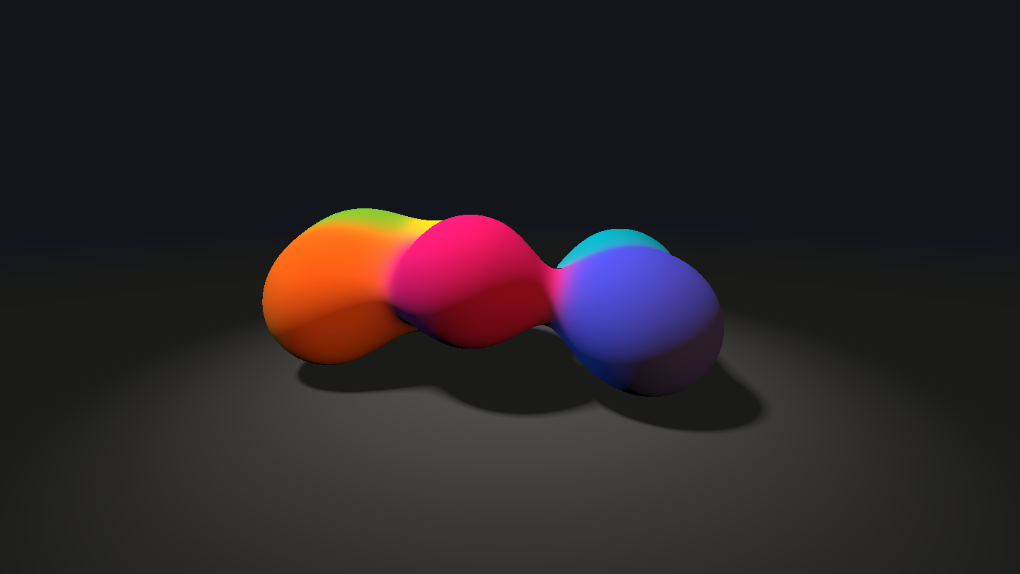 Im dunklen Studio eine Kette aus drei ineinandergeflossenen Tropfen, orange, pink und violett, mit schmalen Hälsen dazwischen, dahinter ein türkiser; sie stehen in einem hellen Lichtkreis auf dem dunklen Boden und werfen Schatten mit weichen Rändern.